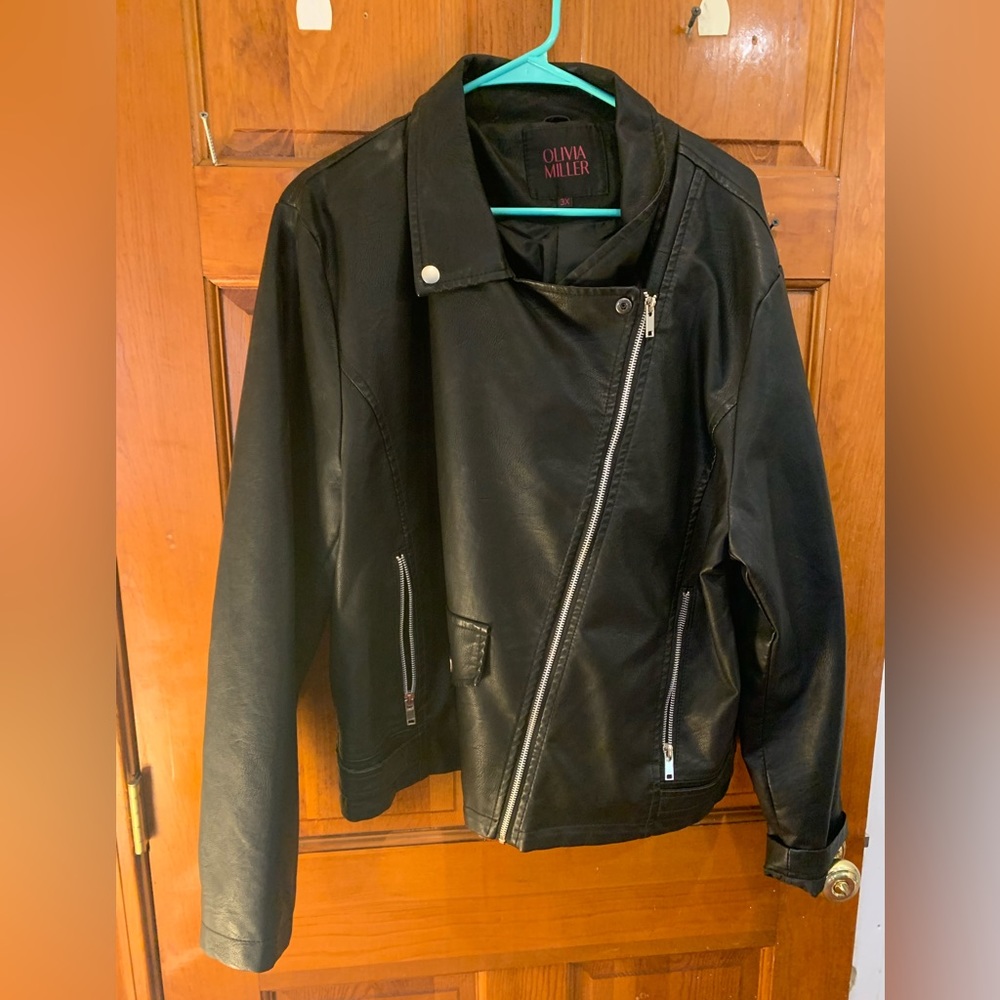 Women’s black biker jacket. Says Size 3X but runs small.